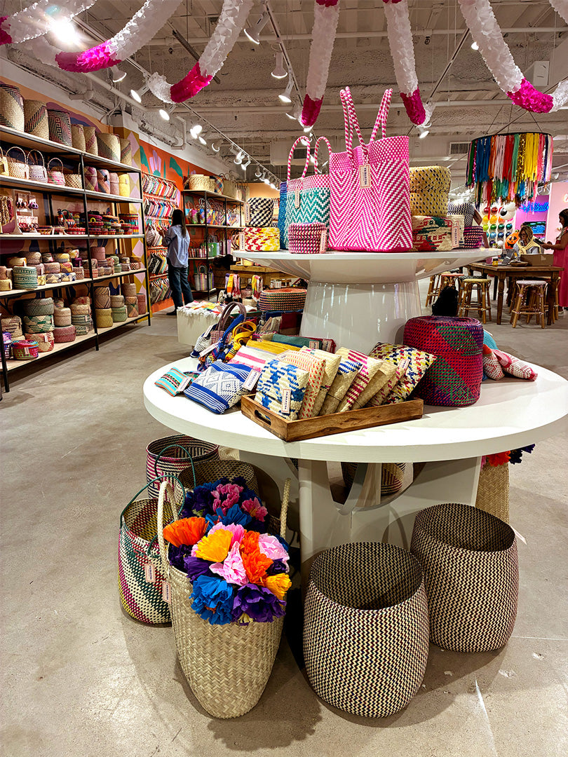 Store interior with colorful bags and products on display