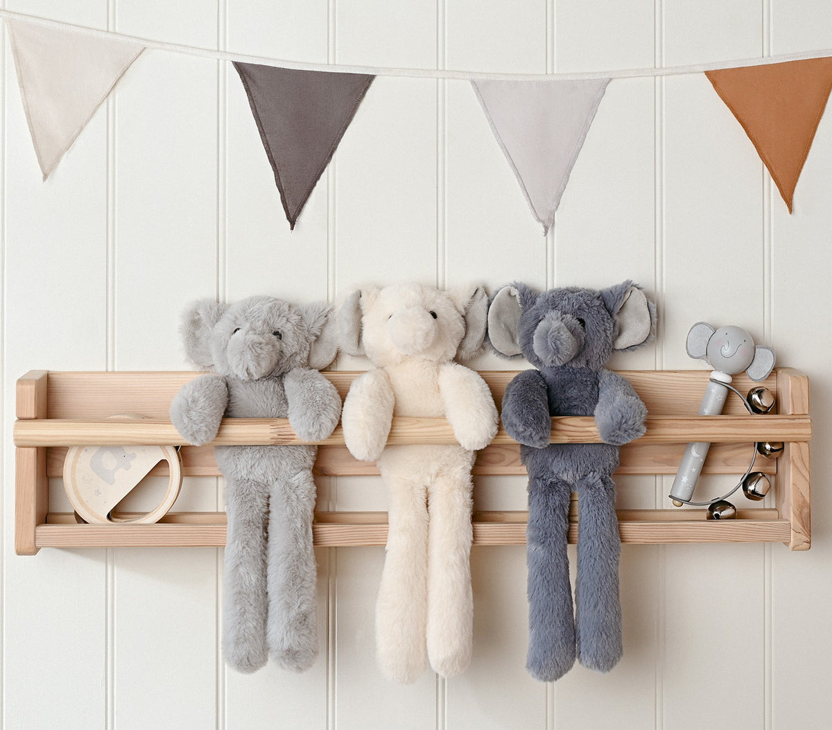 The Softies elephants on a nursery shelf